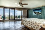 Master bedroom with king bed and morning sunrises over the ocean